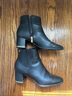 Calvin Klein black leather Chelsea zip up heeled booties with gold detail